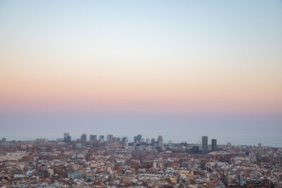 High angle view of city at sunset