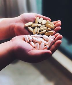 Close-up of hand holding medicines