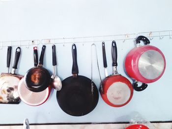 Close-up of kitchen utensils on wall at home