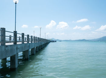 Pier over sea against sky