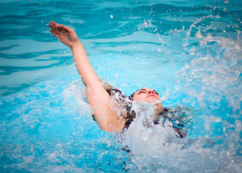 Man swimming in pool