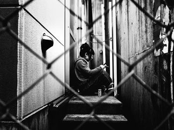 Boy sitting outdoors