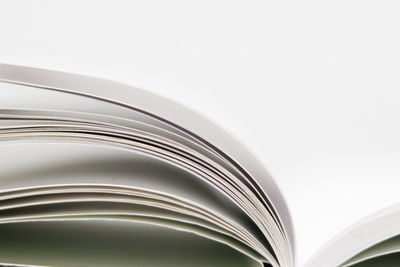 Close-up of open book against white background