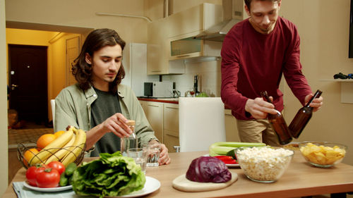 Man and woman standing at home