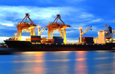 Commercial dock by pier against sky