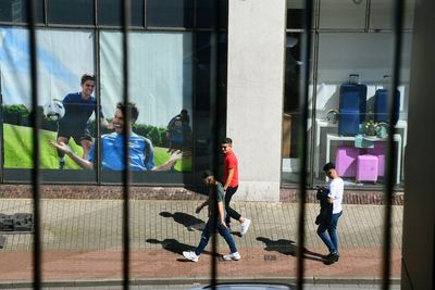 Group of people running on building