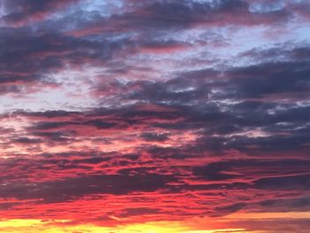 Low angle view of dramatic sky during sunset