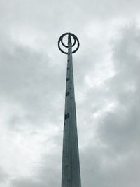 Low angle view of communications tower against sky