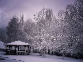 Snow covered house against sky