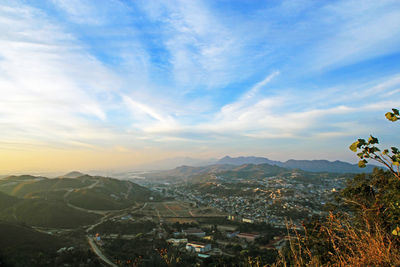 Scenic view of mountains against cloudy sky