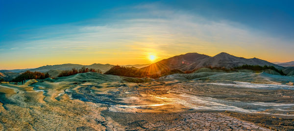 Scenic view of mountains against sky during sunset