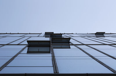 Low angle view of skyscraper against clear sky