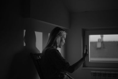 A young woman taking a selfie