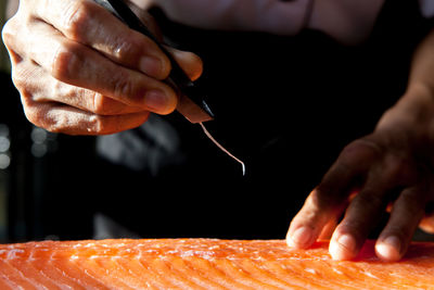 Midsection of chef preparing food