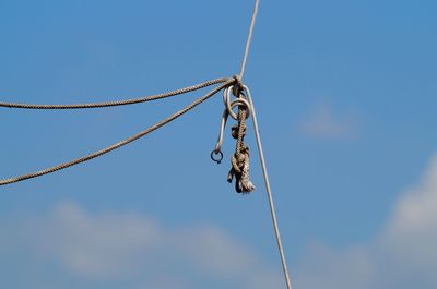 Low angle view of rope against sky