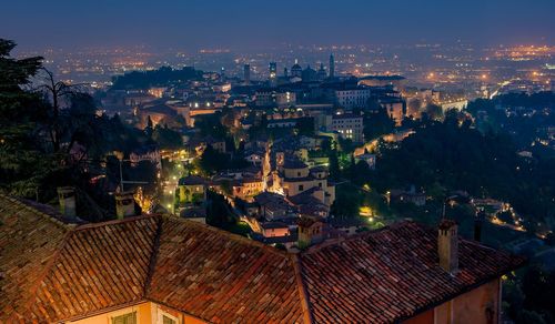 High angle view of illuminated buildings in city