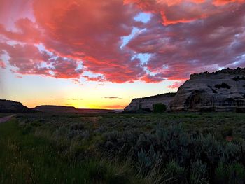 Scenic view of landscape against dramatic sky