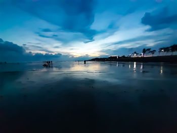 Scenic view of sea against sky at sunset