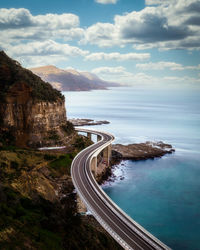 High angle view of road by sea against sky