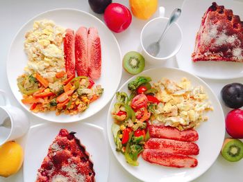 Directly above shot of food served in plates on table