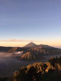 View of volcanic landscape against sky during sunset