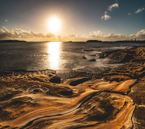 Scenic view of sea against sky during sunset