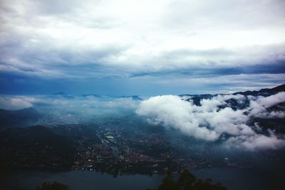 Scenic view of mountains against cloudy sky