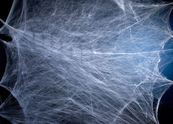 Close-up of broken glass against black background