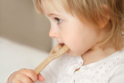 Close-up of girl eating food