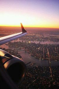 Cropped image of airplane flying over sea
