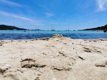 Scenic view of beach against blue sky