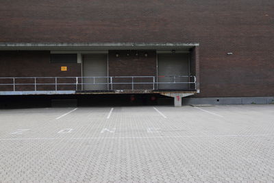 Empty parking lot outside building