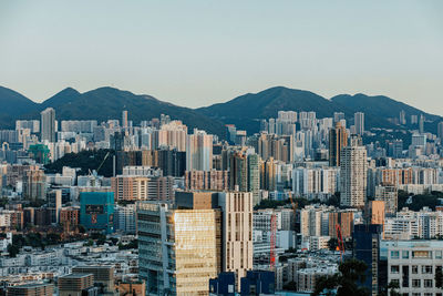 Modern buildings in city against clear sky