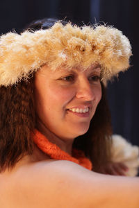 Close-up portrait of smiling young woman