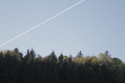 Low angle view of vapor trail against clear sky