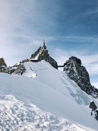 Snow covered mountain against sky