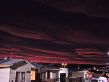 Low angle view of illuminated building against sky