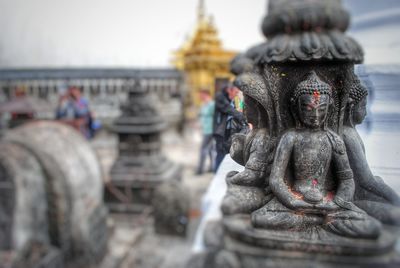 Close-up of statue against temple