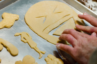 Close-up of person preparing cookies
