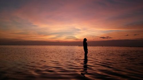 Silhouette of people on beach