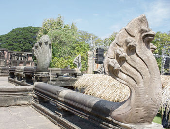 Statues against clear sky