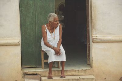 Woman in front of building