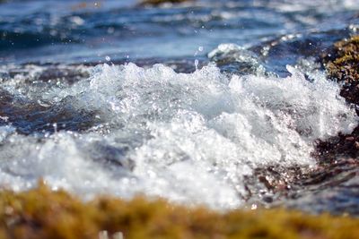 Close-up of waves splashing in sea