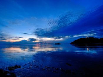 Scenic view of sea against blue sky