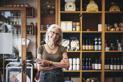 Portrait of a smiling young woman in store