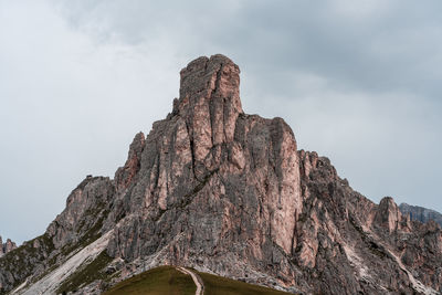 Low angle view of rock formation against sky