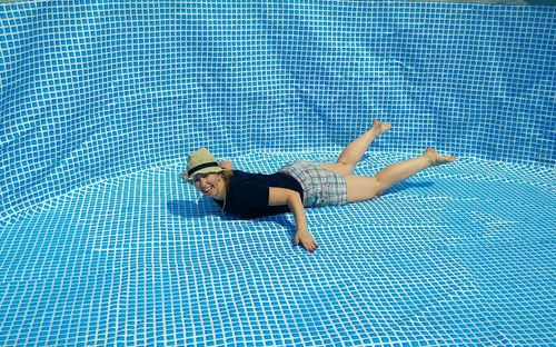 Woman swimming in pool