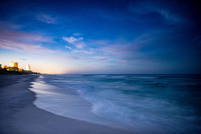 Scenic view of sea against sky at sunset