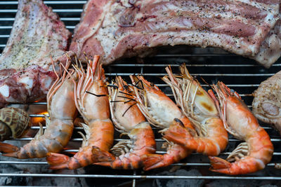 Close-up of fish on barbecue grill