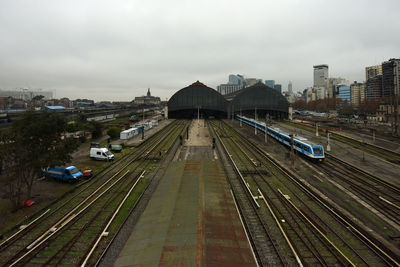 High angle view of railroad tracks amidst buildings in city